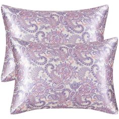 two purple paisley pillows on a white background