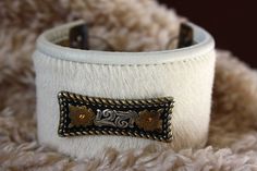 Easy to wear, comfortable and oh-so-western leather cuff with a handmade sterling silver clasp, etched brass end-pieces and a pretty silver concho. These measure 1 3/4" wide by 8" long and fit an average wrist. Simple, understated cowgirl bling to brighten up any outfit. Made to last you a long time, too! Handmade White Leather Jewelry, Adjustable White Leather Bracelet, Western Style Leather Bracelet With Concho, Western Style Leather Bracelet With Concho As Gift, Western Style Leather Concho Bracelet As Gift, Handmade White Cuff Bracelet, White Leather Bohemian Jewelry, White Bohemian Leather Jewelry, Bohemian White Leather Jewelry