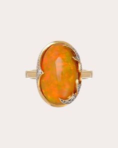 Set atop an 18-karat gold band, the Flare ring is centered around an oval-cut Ethiopian opal. The face's abstract flame motifs are decorated with pavé-set diamond embellishments to create ambient shimmer. From Roberta do Rio's Fire Spell Collection. 18k yellow gold, Ethiopian opal and diamond Carat: 0.0006 ctw diamond, 8.9 ctw opal Polish with soft cloth Made in Brazil Measurements Size 7 inner diameter: 17.3mm (0.68in) Modern Oval Opal Ring For Formal Occasions, Luxury Oval Opal Ring For Anniversary, Opal Rings With Polished Finish For Formal Occasions, Modern 14k Gold Oval Opal Ring, Elegant Opal Ring With Polished Finish, Formal Opal Rings With Polished Finish, Elegant Opal Rings With Polished Finish, Elegant Oval Opal Ring With Polished Finish, Fine Jewelry Opal Ring With Diamond And Gemstone Accents