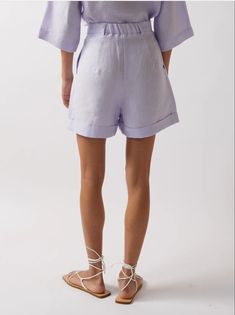 CASA RAKI Clementina Shorts Lilac This comfortable pair has a relaxed but structured silhouette with a high-rise waist, giving the option of wearing it with a belt. The most versatile pair of shorts that can be worn on special occasions or more casual locations. Composition: 100% GOTS Certified Organic Linen Color: Lilac Fit: True to Size High Waist Belted Bottoms For Spring, High Waist Belted Cuffs Bottoms For Spring, High Waist Bottoms With Belted Cuffs For Spring, Casual High-waist Bottoms With Belted Cuffs, Casual High Waist Bottoms With Belted Cuffs, High-waisted Linen Shorts For Daywear, Casual Spring Bottoms With Belted Cuffs, Casual Summer Pants With Belted Cuffs, Relaxed Fit Bottoms With Paperbag Waist And Belt Loops