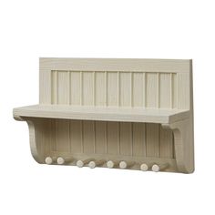 a white wooden shelf with three hooks on the top and two shelves below it,