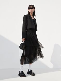 MO&Co. Women's Elasticated Ruffle Laced Skirt Features : - Midi length with a flowy fit- Elasticated waist- Asymmetrical, tulle ruffle layers design Code: MBC1SKTT11The back length of size S is 82cmMATERIALS & CARE Material: 100% PolyesterGentle machine wash below 30°CDo not bleach, hang to dry in the shadeDo not tumble dry, do not ironDo not dry clean, do not soakDo not rub, wash separately in mesh bagWash with neutral detergentPlease select your own size in the size chart according to your fig Black Skirt Wedding Outfit Guest, Black Ruffled Skirt Outfit, Layered Skirt Outfit, Tulle Skirt Fashion, Ruffle Skirt Outfit, Tulle Layered Skirt, Short Tulle Skirt, Layers Outfit, Black Ruffle Skirt