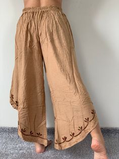 "Lady's ethnic Indian trousers original cut of natural pink material. Soft cotton jersey very natural and feminine drape. Form pants perfectly preserved due to the special machining of parts seam. Panels are fixed on a soft zone, passing in strings. fabric structure 100% cotton jersey Detail & Measurement : * Trouser Style * Trouser are one-size-fits-all * Waist (elastic waistband with robe): 24\"- 44\" (61 cm - 112 cm) * Hips up to : 54\" (138 cm) * Rise : 13: 31\" (79 cm) * Length : 41\" ( Non-stretch Beige Cotton Harem Pants, Cotton Wide Leg Pants Ankle-length, Bohemian Beige Relaxed Fit Harem Pants, Beige Bohemian Relaxed Fit Harem Pants, Traditional Linen Pants For Summer, Traditional Linen Summer Pants, Traditional Summer Linen Pants, Traditional Loose Fit Harem Pants For Spring, Bohemian Cotton Straight Pants