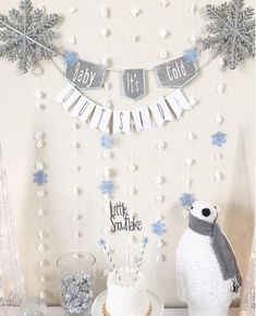 a baby it's cold outside party with snowflakes, cake and decorations