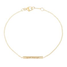 a gold bracelet with the word great escape engraved on it