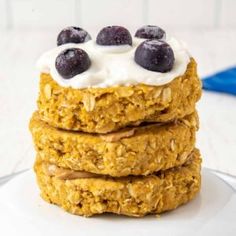 three oatmeal breakfast cookies with blueberries on top