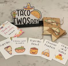 taco two - day cards are laid out on a table