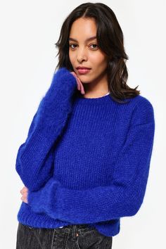 This lightweight sweater is made from luxurious Suri Alpaca and features a distinctive fluff and soft texture on the hand-brushed sleeves. It is expertly crafted by one of Muna's partner workshops in La Victoria, Lima, making it the perfect trans seasonal piece. Composition: 74% SURI ALPACA / 26% MERINO WOOL Model is shown in a S/M. Suri Alpaca, Blue Sweater, Lightweight Sweater, Soft Texture, Light Weight Sweater, Soft Textures, Blue Sweaters, Alpaca, Merino Wool