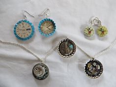 "A variety of necklaces and earrings made with upcycled watch parts.  The necklaces come with a 19\" silver tone link chain. 1 - Dangle watch earrings with teal colored border.  The largest earring is 1 1/2\" round and the second is 1 1/4\" round. 2 - Mickey mouse dangle earrings.  One of the earrings glows in the dark and they are 7/8\" round. 3 - 1 1/2\" Round pendant necklace with recycled watch parts and turquoise beads. 4 - 1 1/2\" Round pendant necklace with recycled watch parts and a turq Vintage Upcycled Jewelry As Gift, Nickel-free Round Pendant Jewelry For Vintage Collection, Unique Upcycled Jewelry Gift, Unique Upcycled Jewelry For Gifts, Unique Upcycled Jewelry As A Gift, Watch Earrings, Recycled Watch, Saranac Lake Ny, Round Pendant Necklace