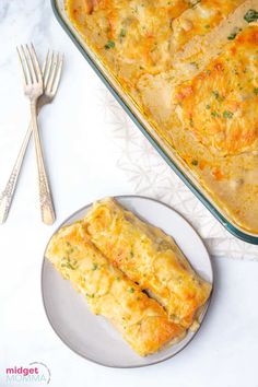 two slices of cheesy bread on a plate next to a casserole dish