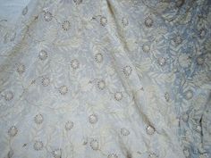 Dyeable Embroidered Fabric by the Yard Indian Sequin Saree white Georgette Sequined Wedding Dress Crafting Sewing Costumes Chikankari. Dye it in any color of your choice, beautifully designed Machine Chikankari Fabric with dense embroidery (chikankari), making it an elegant party-wear outfit. You can use this fabric to make dresses, tops, Crafting, Drapery, Home Décor, Outdoor, Quilting, Sewing, General, Upholstery etc. ➤ Color : Ivory, Gold Georgette Sequence Work Fabric (Dye it in any color of Fitted Embroidered Lace Fabric For Ceremony, Cream Embroidered Fabric With Floral Design For Ceremony, Cream Embroidered Fabric For Ceremony, Cream Floral Embroidered Fabric For Ceremony, Ceremony Cream Embroidered Fabric, Fitted Embroidered Fabric For Wedding With Intricate Design, Fitted Wedding Fabric With Intricate Embroidery, White Bollywood Dress With Motifs, Festive Off-white Floral Embroidered Fabric