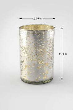 a gold and silver candle holder with measurements