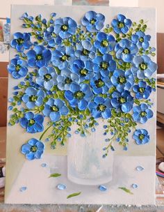 a painting of blue flowers in a vase