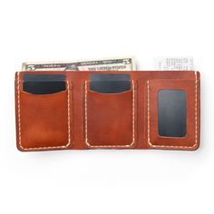 A leather Trifold wallet that carries everything you could possibly need.On the go, this wallet is the perfect accessory. You'll soon find that this wallet can take everything you throw at it and store it neatly folded away. Flip out your ID whenever it's needed, and fill the billfold with any size currency, notes, or even receipts.This full-grain leather wallet is designed to hold a lot of cards and a lot of cash. Easily flip out your ID when it's needed and the wallet will naturally fold back Full Grain Leather Wallet, Leather Trifold Wallet, Horween Leather, Engraved Initials, Flip Out, Personalized Keychain, Trifold Wallet, Full Grain Leather, Tan Leather