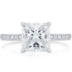 a princess cut diamond ring with channeled shoulders