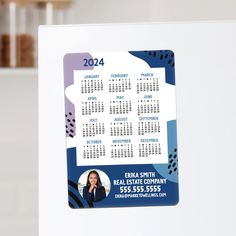 a white refrigerator with a calendar on it