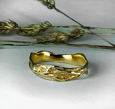 Wedding ring,Twig ring,Mens wedding band Gold band handmade in solid 14 carat yellow gold. Perfect as a wedding band for women and men. Very practical, easy to wear everyday, looks different and interesting from every side. Inspired by nature, trees, branches and bark tree. Very practical, easy to wear everyday. It looks different from each side. Ring is 7 mm wide and 2 mm thick (it's uneven, between 7 and 3 mm wide) All items come in a gift box... perfect for gift giving and storage. Organic Gold Ring, Mens Wedding Bands White Gold, Wedding Band White Gold, Ring Tree, Unique Wedding Ring, Mens Gold Wedding Band, Twig Ring, Tree Ring, Rings Mens Wedding Bands