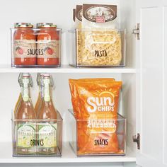 an open refrigerator filled with lots of food and drinks on top of white shelving