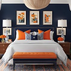 a bedroom with blue walls and orange accents