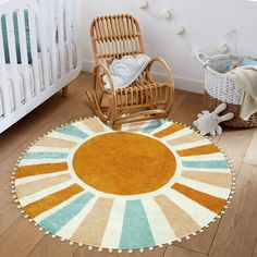 a baby's room with a rocking chair and rug