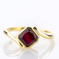 A piece from our collection, featuring a natural ruby of 2.0 carats set into a timeless yellow gold design.   Metal 14k / 0.585 gold Gemstones 1 ruby 2.0ct Measurements Head 9.0mm Shank 2.1mm Ring size 7 US Weight 3.8g Condition New General Information All items come with certificate of authenticity, gemstones have been tested at our lab if not otherwise indicated. Pendants are shown with chain for decorational reasons, please note that they do not come with a chain. Payment We accept payment th Gold Emerald Cut Ruby Ring, Gold Emerald-cut Ruby Ring, Red Ruby Birthstone Ring Stamped 14k, 14k Stamped Ruby Ring Round Cut, Red Ruby Ring In 14k Gold With Bezel Setting, Classic Ruby Diamond Ring In Yellow Gold, Formal Ruby Ring In Yellow Gold, Classic Yellow Gold Ruby Ring With Lab-created Ruby, Ruby Birthstone Ring In Yellow Gold