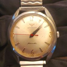 1950's Wittnauer Mens Automatic Watch Timepiece. My Father Owns This And Has Had It For Most Of His Life ; He's 82 Now. He Told Me It Has Never Stopped Working. It's Been In His Drawer Not Being Used For At Least 50 Yrs And It's Still Kickin!Kicking!! Definitely Quality At Its Finest! Vintage White Watch With Tachymeter, Vintage White Analog Watch, Retro White Watches For Formal Occasions, White Retro Watch For Formal Occasions, White Retro Formal Watch, White Retro Formal Watches, Vintage Automatic Watch For Formal Occasions, Vintage White Watch Accessories With Round Dial, Vintage Automatic Watches For Formal Occasions