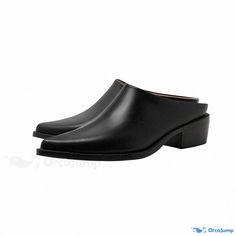 a pair of black shoes on top of a white background