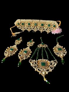 pearl wedding jewellery.                                        set includes chokar necklace,earrings, jhumar ,tikka Green Stone Work Tikka For Festivals, Green Tikka With Stone Work As Gift, Green Tikka For Party And Festivals, Green Bollywood Jewelry With Stone Work, Bollywood Style Green Jewelry With Stone Work, Green Kundan Necklace For Party And Festivals, Green Kundan Necklace For Festivals And Parties, Green Jewelry Sets With Stone Work As Gift, Green Bridal Necklace With Stone Work As Gift