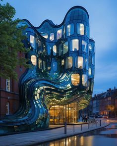 an unusual building is lit up at night