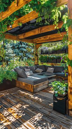 an outdoor living area with wooden flooring and plants growing on the roof, surrounded by greenery