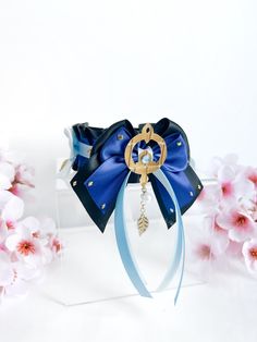 ♡ Inspired by character Scaramouche/ Wanderer from Genshin Impact♡ 38mm thickness♡ Made from high quality satin material♡ Not designed for tugging or leash attachments♡ Collar is adjustable♡ D-ring ribbon closure♡ Gold hardware usedAdd on details:♡ Handmade bows♡ Handmade faux leather cutout of scaramouche's accessory♡ Blue and gold rhinestones♡ White solid pearl and gold leaf charms Collar measurements:♡ Our collars are measured from the start and end of each D-rings. Each D-ring takes up about 1 inch eachNote:♡ This listing is a sale for the collar only. Matching bows are sold separately♡ Due to the nature of handmade items, there may be minor imperfections♡ All faux leather shapes, bows, small and large are all handmade♡ All Kahweiei items are purely made for accessorising and wearing a Scaramouche Wanderer, Hair Accessories Clips, Mini Bows, Bow Set, White Solid, Leaf Charms, Handmade Bows, Gold Rhinestone, Satin Material