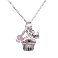 Adorable cupcake charm necklace with swirled frosting and pink sprinkles accented with silver puff heart and pink Swarovski crystal charms! Makes the perfect gift for baby's first birthday or any birthday celebration! The fun charm floats on a 14" Italian chain and has a coordinating bracelet available as well. What a special keepsake gift for toddlers, little girls and children! Necklace comes in beautiful gift box that kids love. Swirled Frosting, Silver Cupcakes, Pink Sprinkles, Cupcake Necklace, Italian Chain, Cupcake Charms, Baby's First Birthday, Charmmy Kitty, Girly Accessories