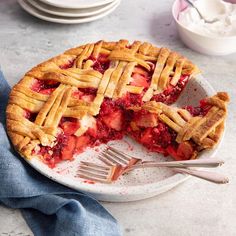 a slice of strawberry pie on a plate with a fork