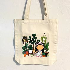 This stylish tote bag is perfect for the plant lover, home gardener, or anyone who wants to show off their love for nature. It is made of 100% cotton and features a cute design. Its roomy size is perfect for carrying groceries, books, and other everyday items. This tote bag is perfect for back to school, the beach or for your groceries. Get it before it's gone! Approximate measurements: Width 15" Length 16" Material: 100% cotton canvas Colors might look different in your screen. Follow me @Jolli Botanical Cotton Tote Bag, Botanical Style Cotton Tote Bag, Botanical Cotton Canvas Bag For Everyday Use, Botanical Cotton Canvas Bag For Daily Use, Botanical Cotton Canvas Tote Bag, Botanical Cotton Canvas Gift Bag, Botanical Style Rectangular Cotton Canvas Bag, Cotton Tote Bag With Plant Print, Cute Cotton Canvas Bag For Everyday