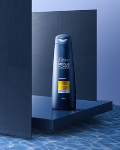 a bottle of dove men's deodorant next to a blue wall