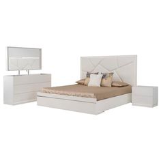 a white bed sitting next to a night stand and dresser with two pillows on it