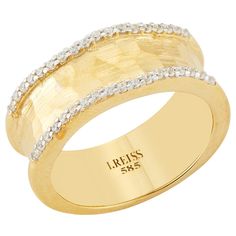 a gold ring with white diamonds on it