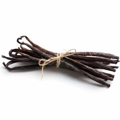 vanilla sticks tied up with twine on white background