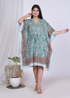 This kaftan / Caftan , made from incredibly soft and lightweight cotton, is versatile for many occasions. Perfect for a swimsuit cover up on the beach or by the pool, with shorts and a tank top or over a summer dress. Can be also worn with a glam belt for a more dressed up look for lunch. It compliments all body types with its long, hangs loose design. It can be worn in many different stylish ways to make you look your best! The cotton tie accent at the waist makes it easy for you to wear. SHORT KAFTAN ITEM DETAILS * Fabric - 100%Cotton * Pattern - Floral * Size - One size fits all ! . * Bust/chest size - Fit Up to 66″ Inches * Length - 36/38″Inches * Wash care: Hand / Machine wash in cold water. Usage - Tunic, Gown, Maxi, Bikini Cover up, Beach Wear, Caftan, Maternity Wear, Night wear, nu Multicolor Tunic Kaftan For Loungewear, Free Size Cotton Short Sleeve Kaftan, Free Size Cotton Kaftan With Short Sleeves, Green Printed Free Size Kaftan, Free Size Cotton Kaftan With Kimono Sleeves, Festive Cotton Tunic Kaftan, Cotton Kaftan With Kimono Sleeves, Festive Green Kaftan For Vacation, Festive Green Kurta For Beach Occasions