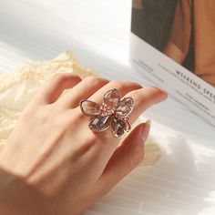 Floral Crystal Ring Rose Gold Metal Rings For Wedding, Adjustable Crystal Flower Ring, Elegant Flower Shaped Metal Rings, Rose Gold Metal Rings As Gift, Metal Crystal Ring As A Gift, Rose Gold Metal Rings For Gift, Rose Gold Crystal Flower Jewelry, Rose Gold Crystal Flower-shaped Jewelry, Gold Crystal Rings As Gifts