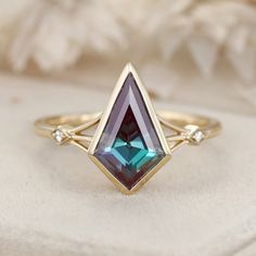 Experience the timeless elegance of our Kite Cut Lab Alexandrite Engagement Ring, set in vintage-inspired 14K solid gold with unique diamond accents. This exquisite ring features a captivating lab-grown alexandrite stone, known for its stunning color-changing properties, paired with sparkling diamonds. Perfect for engagements, weddings, promises, and anniversaries, this ring is a beautiful symbol of love and commitment. Timeless Emerald Diamond Wedding Ring, Timeless Emerald-cut Birthstone Ring For Weddings, Emerald Cluster Ring With Diamond Accents For Wedding, Timeless Emerald Cut Birthstone Wedding Ring, Emerald Cut Birthstone Ring With Diamond Accents For Wedding, Heirloom Emerald Ring With Rose Cut Diamonds For Wedding, Heirloom Marquise Emerald Ring In 14k Gold, Heirloom Sapphire Ring With Rose Cut Diamonds For Wedding, Heirloom Emerald Ring With Accent Stones In 14k Gold