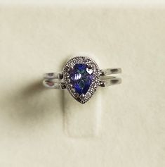 "Description Silver -925 Ring size:- 6 US Stone Name:- natural emerald and tanzanite Stone Size- 7x5 MM Stone shape:-l Pear Item No. D-42 \"Payment\" We Accept Payment Only Through PayPal\"Shipping \"Handling Time: We Take no handling time, We ship to Worldwide,Please make sure your shipping address is correct.Shipping Services: The shipping company takes business to deliver the product 7-13 days for International Shipping.,The Item will be shipped in safe and beautiful packing.Business day does Silver Pear-shaped Halo Ring, Silver Teardrop Halo Rings, Silver Halo Teardrop Rings, Silver Pear-shaped Rings With Halo Detail, Teardrop Halo Ring For Gift, Silver Pear-shaped Ring With Birthstone, Silver Setting Pear-shaped Emerald Promise Ring, Silver Pear-shaped Emerald Promise Ring, Pear-shaped Silver Emerald Promise Ring