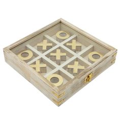 an old wooden box with gold crosses and circles on the inside, sitting on a white background