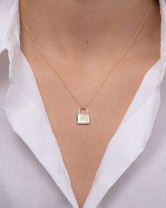 14k gold lock pendant with diamond embellishment and option to add an engraving. Font choices are available in Block, Script, and Gothic. Please refer to our Font & Size Guide for examples. Diamond weight: approx. 0.03ctw Size: Approx. 15mm (H) 11mm(W) Ships in 5-10 business days Rush orders ship in 3-6 business days Comes gift ready in a custom Zoe Lev jewelry box. *Eligible for return, per our policy. See here for details. Lock Necklace, Disc Necklace, Wedding Wear, Personalized Necklace, Ring Bracelet, Shop Necklaces, Gold Chains, Necklaces Bracelets, Anklets