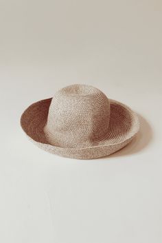 Whether you're attending rowing regattas, enjoying summer picnics, or leisurely drifting down the river, our woven raffia straw hat is the perfect companion. Featuring a timeless dome boater style with a charming flipped edge, it effortlessly combines elegance with a laid-back vibe. This is the epitome of the relaxed yet refined look we're all embracing this year. COUTONIC VINTAGE COLLECTION The COUTONIC Vintage Collection is not just a fashion collection; it's a sustainability-conscious homage Spring Coastal Boater Hat Made Of Toquilla Straw, Vacation Straw Hat With Woven Details, Wide Brim Straw Boater Hat For Vacation, Woven Brimmed Straw Hat For Vacation, Vacation Wide Brim Straw Boater Hat, Brimmed Woven Straw Hat For Vacation, Spring Vacation Straw Boater Hat, Lightweight Paper Straw Hat For Spring, Vacation Woven Boater Hat With Curved Brim