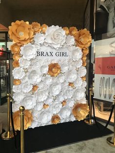 a white and gold flowered backdrop with the words brax girl on it