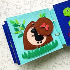 two handmade greeting cards with animals on them, one in blue and the other in green