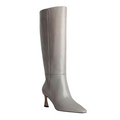 Vince Camuto® Sutton Leather Tall Boot - Wide Calf Add architectural vibes to your look with this sleek boot’s flared angular heel. Styled with a soft snip toe, the Sutton tall boot can be worn with a floral midi dress or classic denim jeans this season and next.