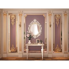 an elegant dressing room with gold trimmings and mirrors on the wall, along with flowers