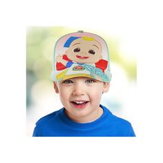 a young boy wearing a hat with a baby on it's face and smiling